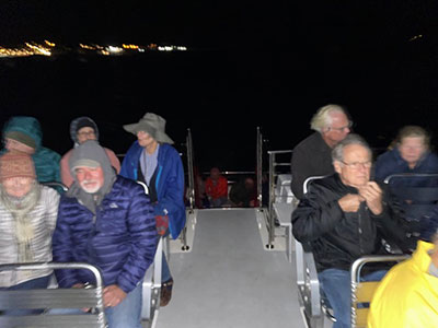 Group of people seated on a boat