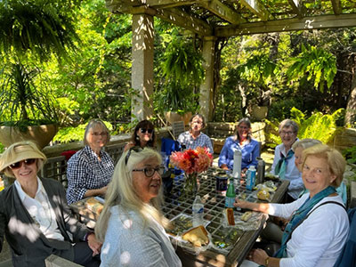 Group of women seated under a gazebo