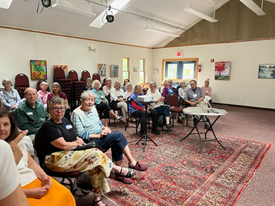 Group of people seated in a room